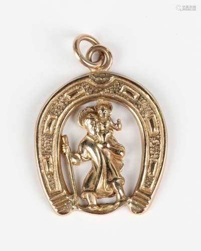 A 9ct gold pendant, designed as St Christopher standing with...