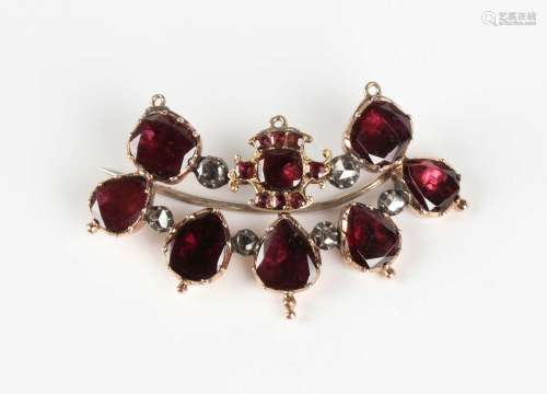 A Georgian gold, foil backed flat cut garnet and rose cut di...