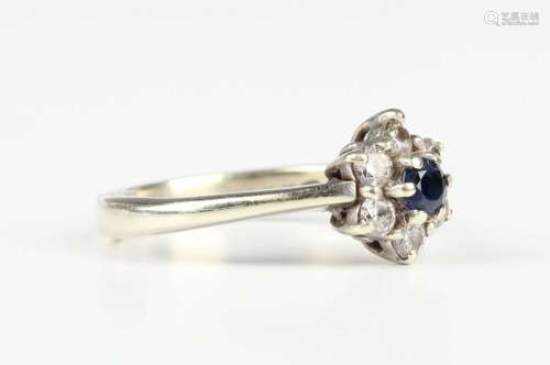 A 9ct white gold, sapphire and diamond seven stone cluster r...