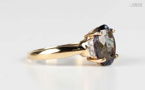 An 18ct gold, chameleon tanzanite and diamond ring, claw set...