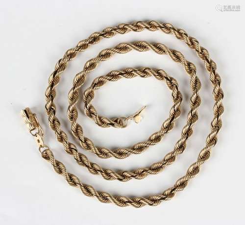 A gold ropetwist link neckchain on a snap clasp, detailed '9...