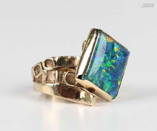 A Scottish 9ct gold and opal triplet ring in a twistover des...