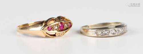 An 18ct gold, ruby and diamond five stone ring in a boat sha...