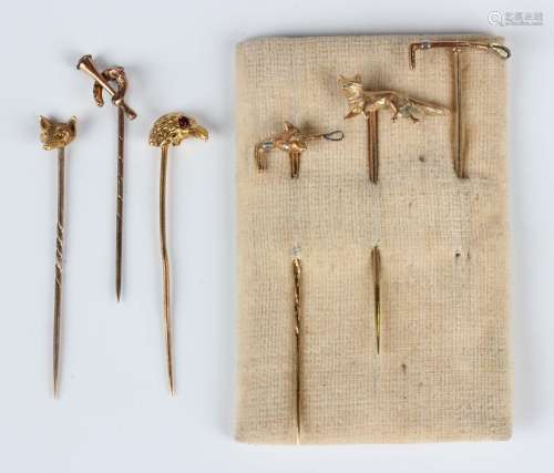 Four gold hunting themed stickpins, comprising a standing fo...