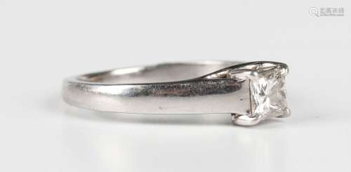 A platinum and diamond single stone ring, claw set with a pr...