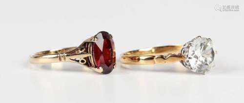 A 9ct gold ring, claw set with an oval cut garnet, Birmingha...