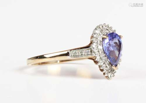 A 9ct gold ring, claw set with a pear shaped tanzanite withi...