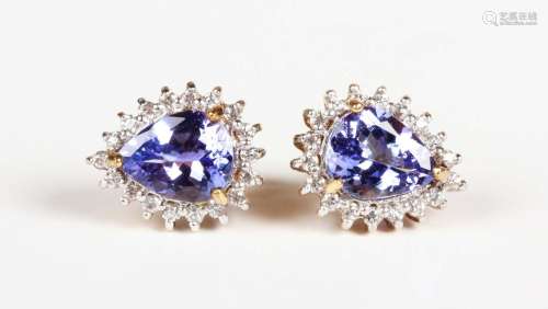 A pair of 9ct gold, tanzanite and colourless zircon earstuds...