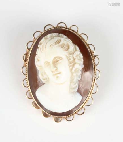 A 9ct gold mounted oval shell cameo brooch, carved as a port...