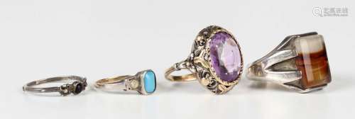 A gold, silver and amethyst single stone ring, mounted with ...