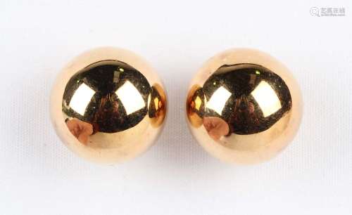 A pair of gold earstuds, each of spherical form with post an...