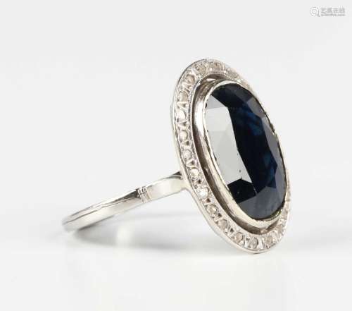 A French white gold, sapphire and diamond oval cluster ring,...