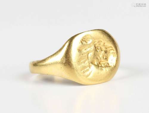 A gold oval signet ring, possibly 18th century, the intaglio...