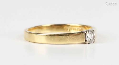 An 18ct gold and diamond single stone ring, claw set with a ...