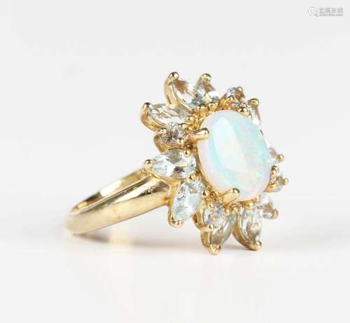 A 9ct gold, opal and aquamarine cluster ring, claw set with ...