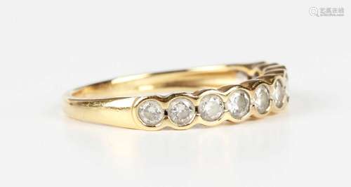 An 18ct gold and diamond half hoop eternity ring, mounted wi...