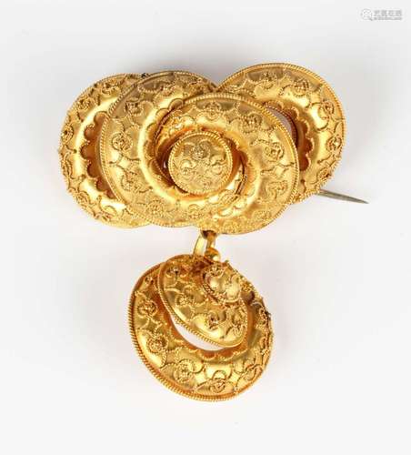 A Victorian gold brooch in an entwined design with a pendant...