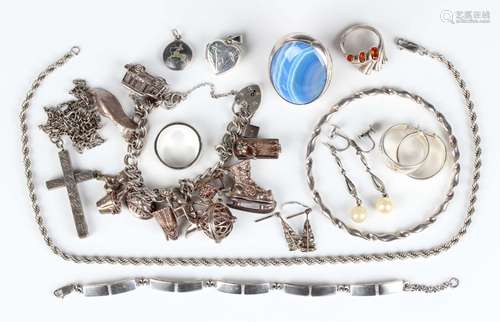 A group of mostly silver jewellery, comprising a twin curbli...