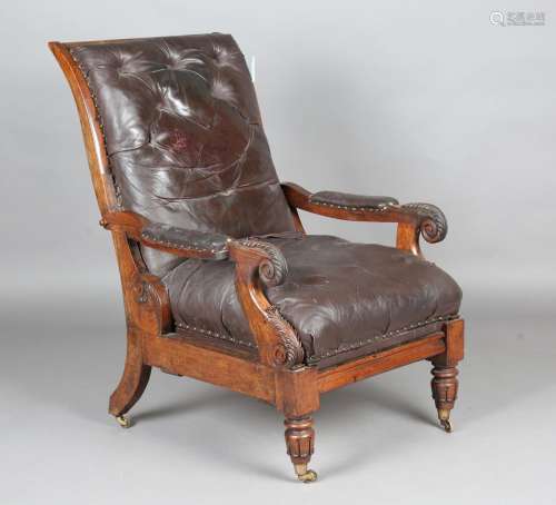 A William IV rosewood framed reclining library armchair