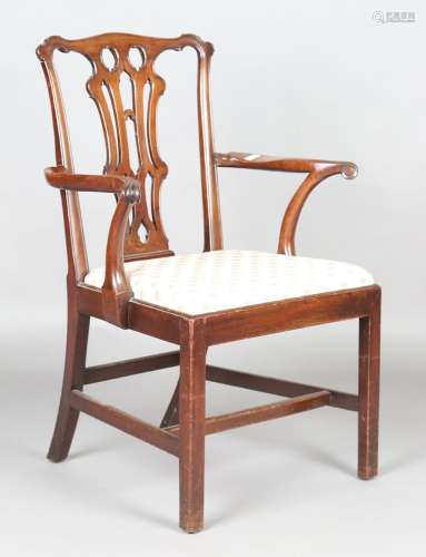 A George III Chippendale period mahogany elbow chair with fi...