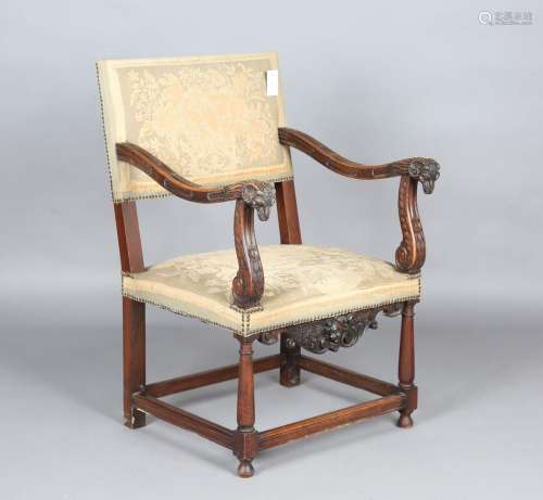An early 20th century Neoclassical Revival walnut elbow chai...