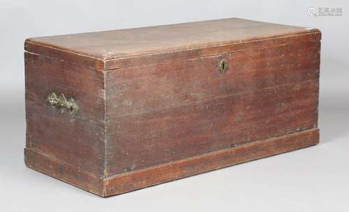 An early 19th century oak trunk with hinged lid and brass ha...