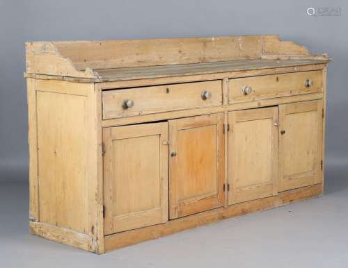 A 19th century pine dresser base with applied gallery back