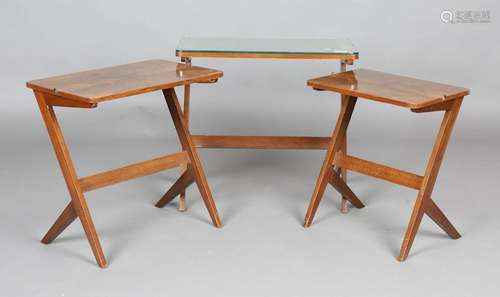 An Art Deco walnut nest of three occasional tables