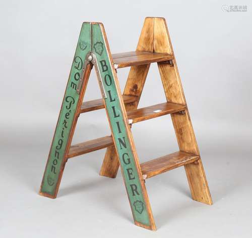 A modern wooden folding stepladder