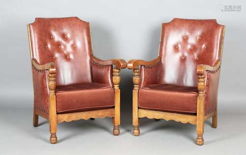 A pair of early/mid-20th century oak framed armchairs