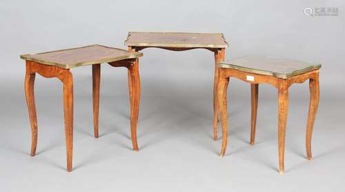 A 20th century French walnut and foliate inlaid nest of thre...