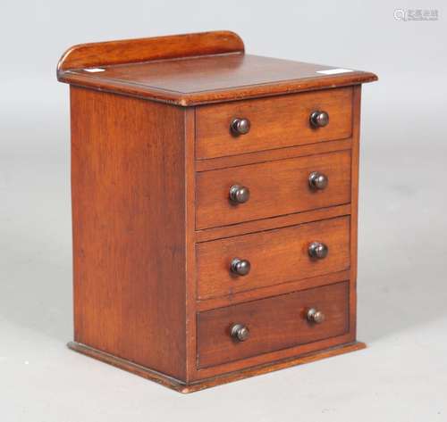 A Victorian walnut table-top chest of drawers