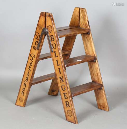 A modern wooden folding stepladder