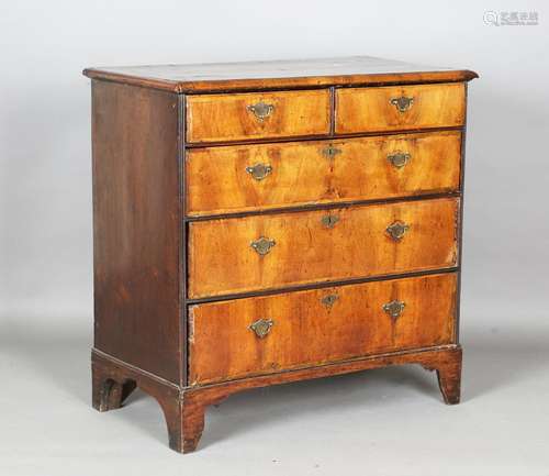 A George I walnut chest of drawers with crossbanded borders