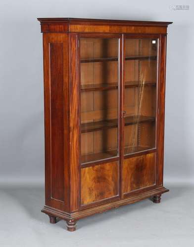 A 19th century figured mahogany two-door glazed bookcase