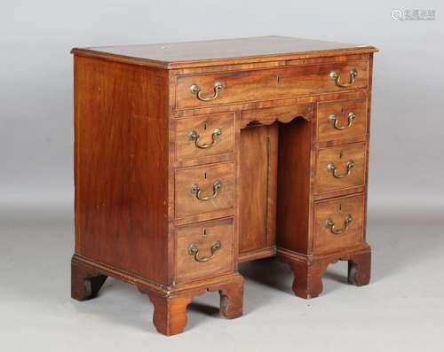 A George III mahogany kneehole writing desk