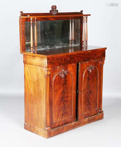 A mid-Victorian mahogany chiffonier with mirror back and fin...