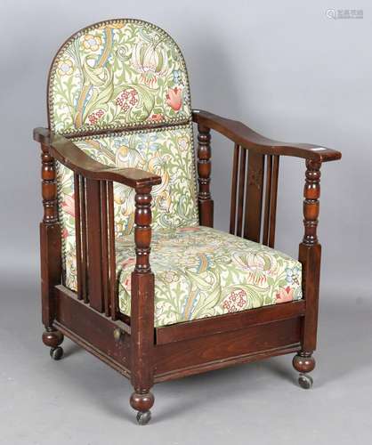 An early 20th century stained beech reclining armchair