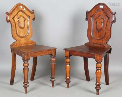 A near pair of Victorian hall chairs