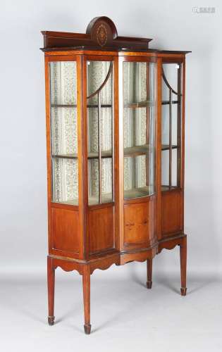 An Edwardian mahogany and boxwood inlaid break bowfront disp...