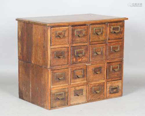 An early 20th century oak and walnut bank of filing drawers ...