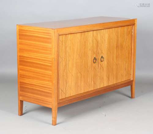 A mid-20th century teak 'Double Helix' side cabinet by Gordo...