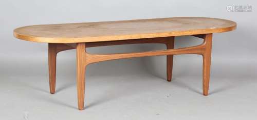 A mid-20th century Danish teak coffee table with curved ends...