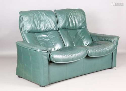 An Ekornes 'Stressless' green leather two-seat reclining set...