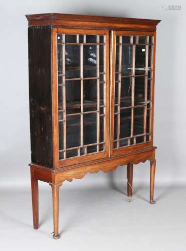 A George III mahogany glazed bookcase top