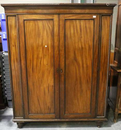 A 19th century figured mahogany two-door wardrobe with appli...