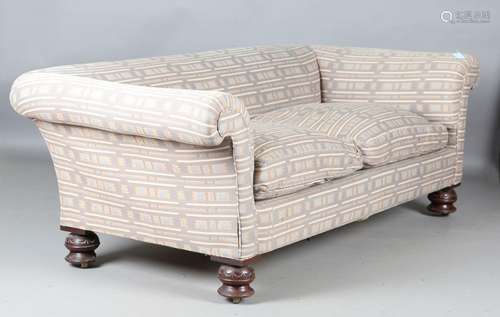 An early 20th century Chesterfield settee with loose floral ...