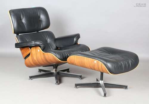 A modern black leather and veneered plywood copy of an Eames...