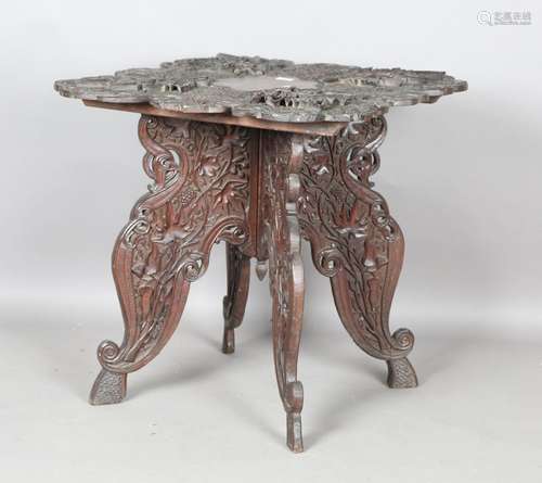 A 20th century Indian carved hardwood occasional table