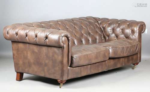 A modern buttoned brown leather Chesterfield settee